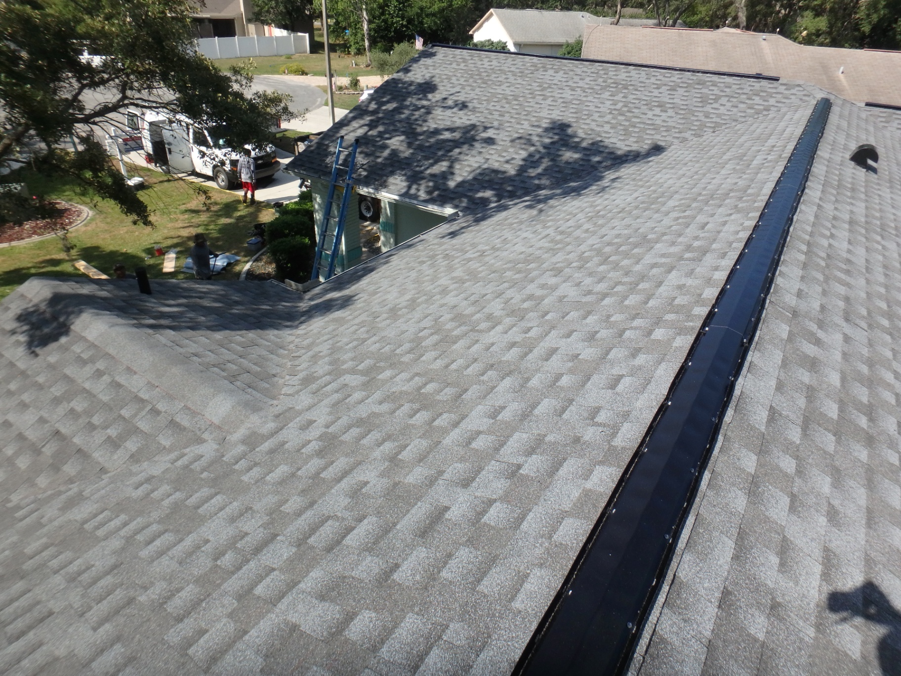 Debris-Covered Shingle Roof → Fresh Architectural Install after