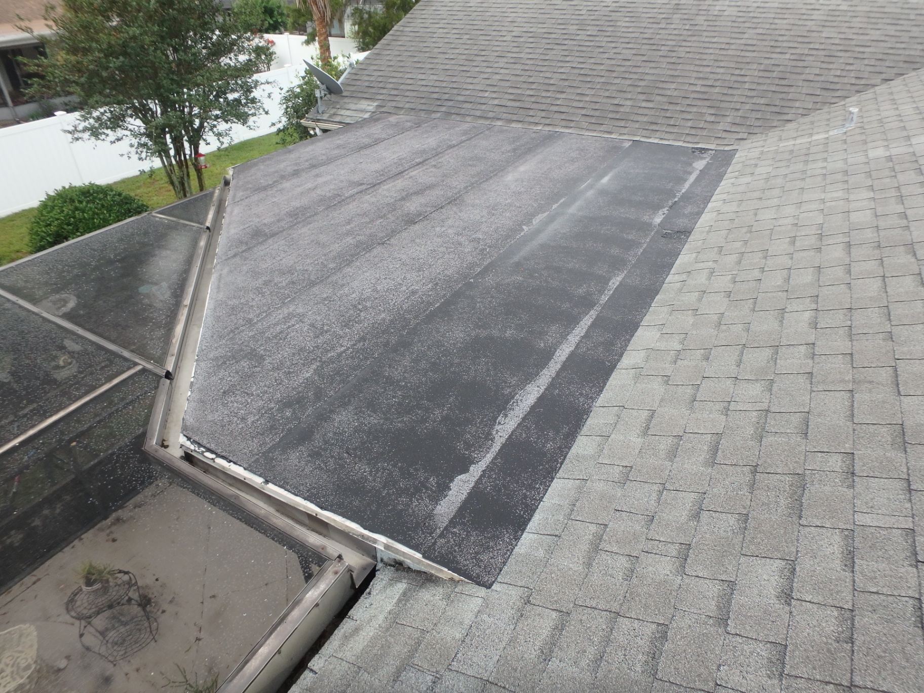 Failing Flat Section → New Modified Bitumen Membrane before